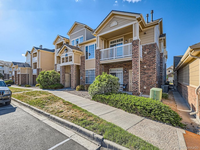 5755 N Genoa Way Unit 14-105, Aurora, CO 80019 - multi unit property with brick siding, central AC unit, and a residential view