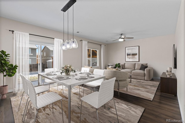 dining room featuring dark hardwood / wood-style floors and ceiling fan