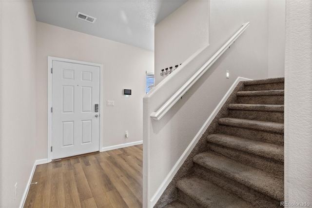 foyer with hardwood / wood-style flooring