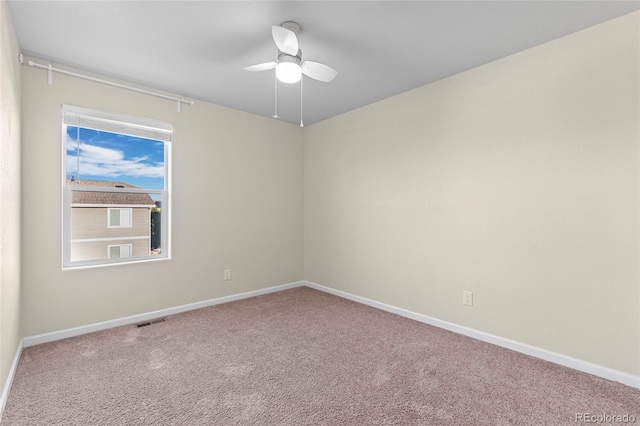 unfurnished room featuring ceiling fan and carpet flooring