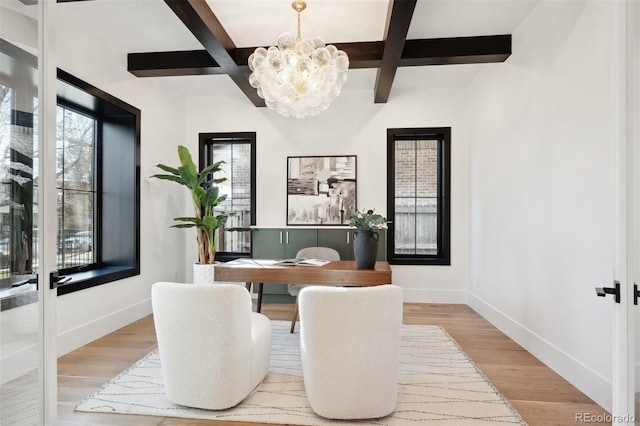 office area with beam ceiling, light hardwood / wood-style flooring, coffered ceiling, and an inviting chandelier