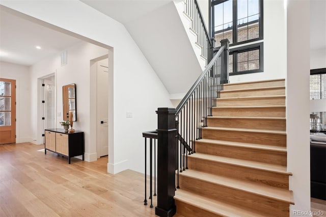 staircase featuring wood-type flooring