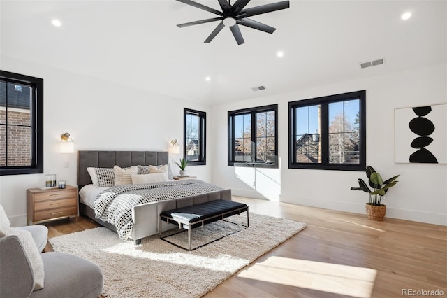 bedroom featuring light wood-type flooring and ceiling fan