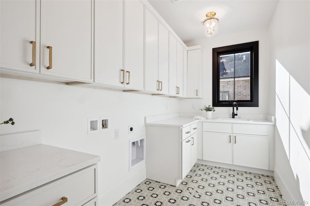 laundry area with washer hookup, electric dryer hookup, cabinets, and sink