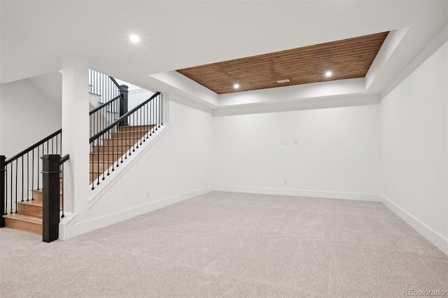 basement with light colored carpet and wood ceiling