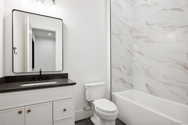 full bathroom featuring vanity, tiled shower / bath combo, and toilet