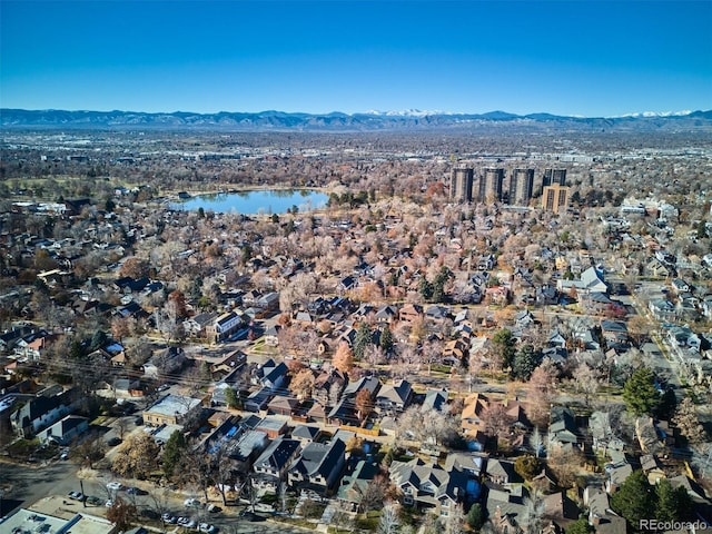 birds eye view of property featuring a water and mountain view