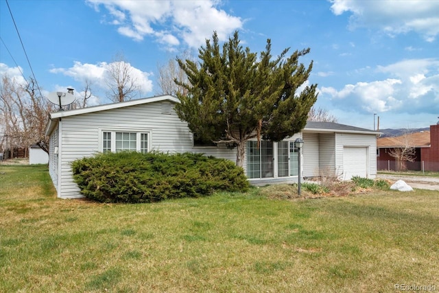 8005 W US Highway 50, Salida, CO 81201 - view of front of house with a garage and a front lawn