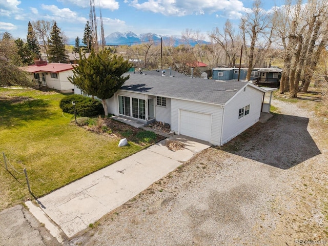8005 W US Highway 50, Salida, CO 81201 - single story home with a mountain view, a garage, driveway, a shingled roof, and a front yard