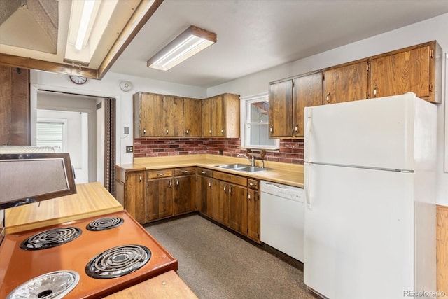 8005 W US Highway 50, Salida, CO 81201 - kitchen featuring white appliances, a sink, light countertops, brown cabinets, and healthy amount of natural light