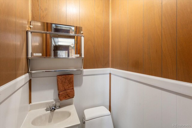 8005 W US Highway 50, Salida, CO 81201 - half bathroom with a sink, toilet, and a decorative wall