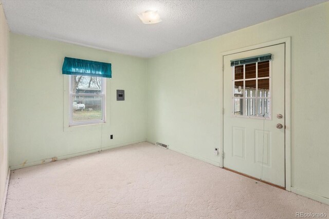 8005 W US Highway 50, Salida, CO 81201 - carpeted empty room featuring a textured ceiling and baseboards