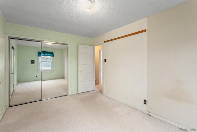 8005 W US Highway 50, Salida, CO 81201 - unfurnished bedroom featuring carpet, a closet, and a textured ceiling