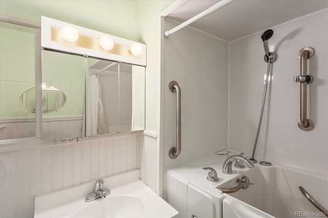 8005 W US Highway 50, Salida, CO 81201 - bathroom featuring shower / tub combo, wainscoting, and a sink