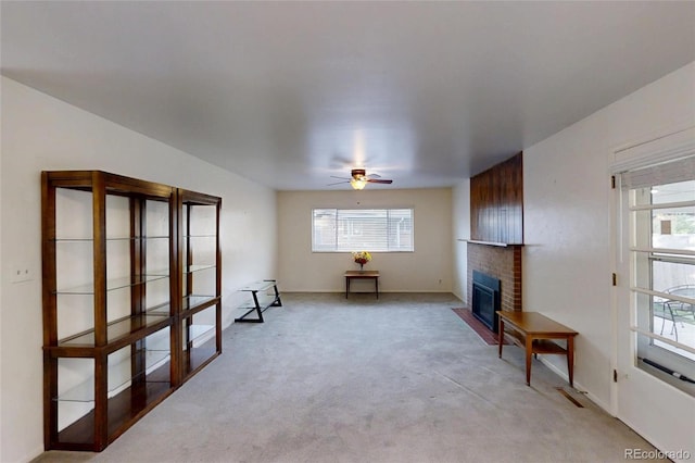 820 Cottonwood Ave, Centennial, CO 80121 - living room with light carpet, ceiling fan, and a fireplace