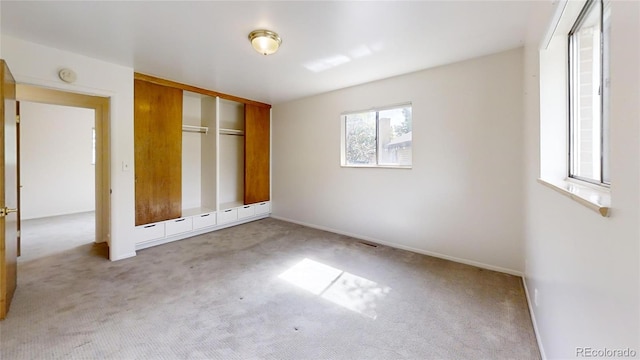 820 Cottonwood Ave, Centennial, CO 80121 - unfurnished bedroom with light colored carpet and a closet