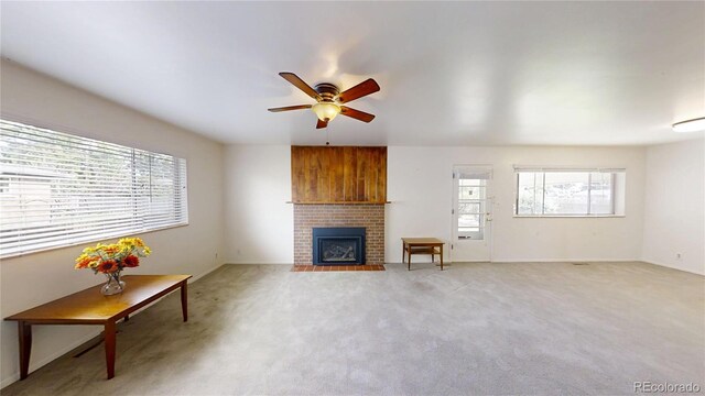 820 Cottonwood Ave, Centennial, CO 80121 - living room with ceiling fan, light carpet, and a brick fireplace