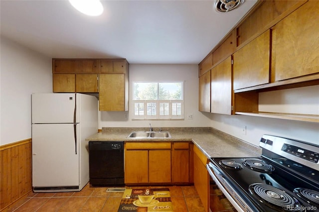 820 Cottonwood Ave, Centennial, CO 80121 - kitchen with stainless steel electric range oven, freestanding refrigerator, dishwasher, brown cabinetry, and light tile patterned flooring