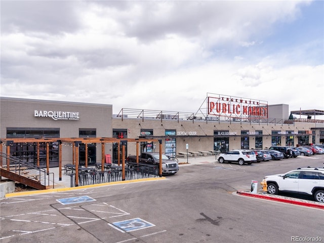 view of property featuring uncovered parking