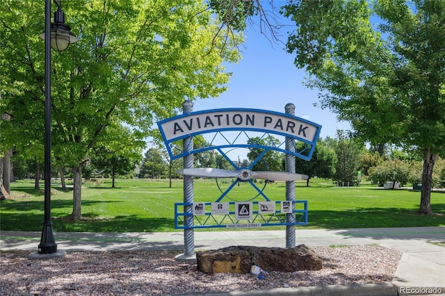 view of property's community with a lawn