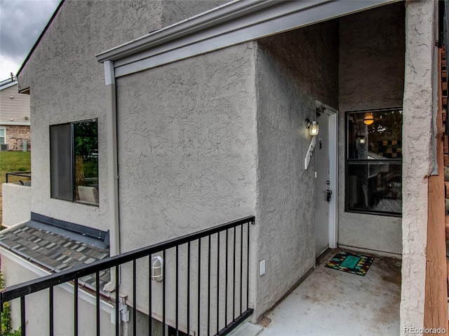 doorway to property with stucco siding