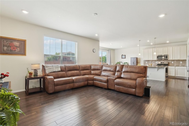 2682 E 161st Pl, Thornton, CO 80602 - living area with dark wood-style flooring and recessed lighting