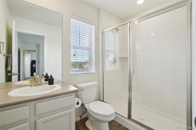 2682 E 161st Pl, Thornton, CO 80602 - bathroom featuring a stall shower, vanity, and toilet