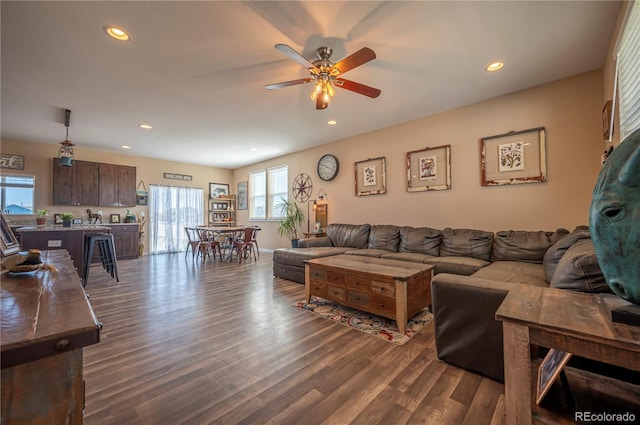 living area with baseboards, a ceiling fan, dark wood-style floors, and recessed lighting