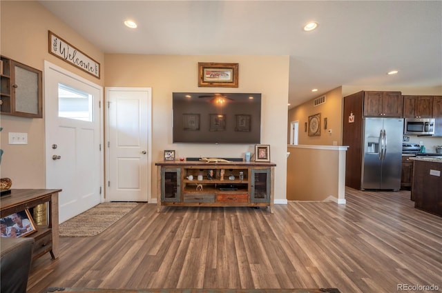 foyer with wood finished floors and recessed lighting