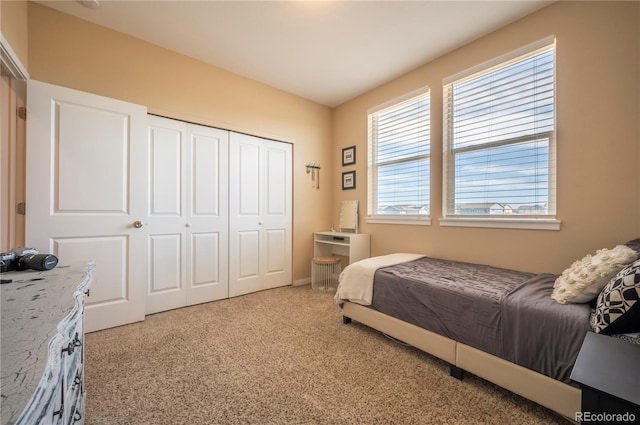 bedroom featuring a closet and carpet flooring