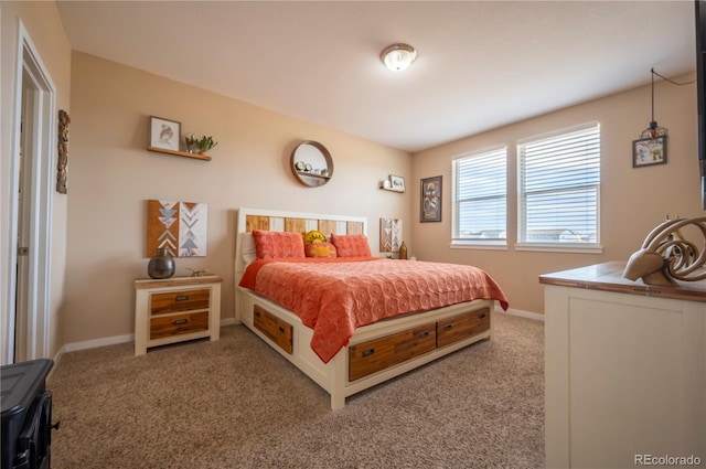 bedroom featuring carpet floors and baseboards