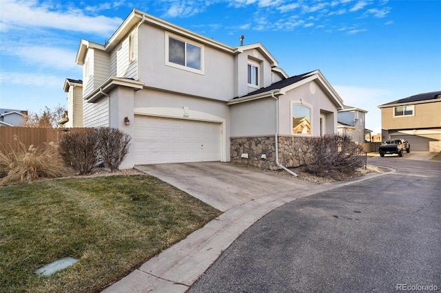 front of property featuring a garage and a front yard