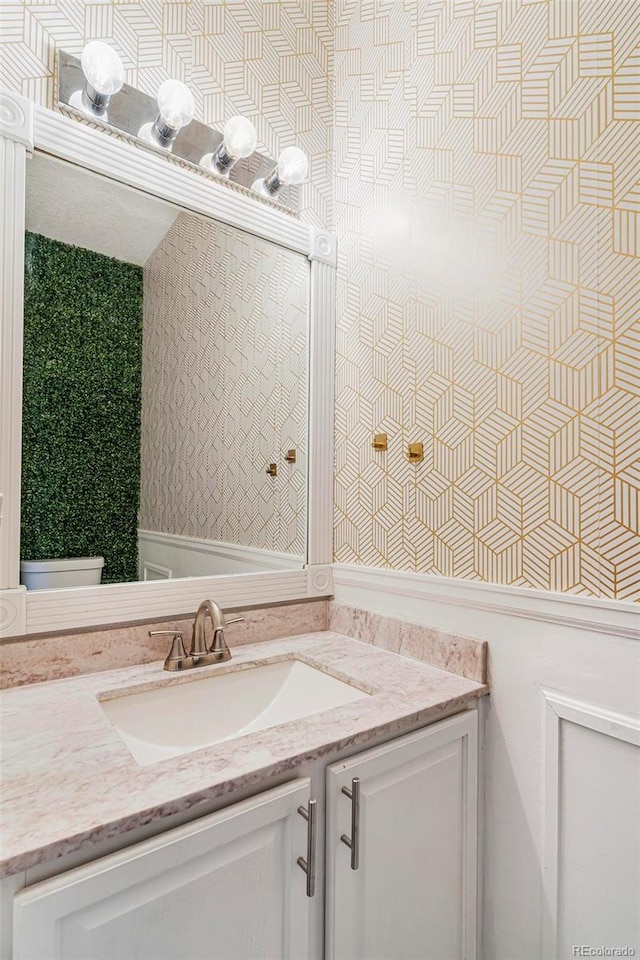 bathroom with vanity and toilet