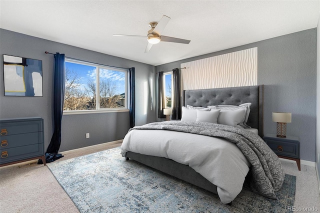 bedroom with ceiling fan and carpet flooring