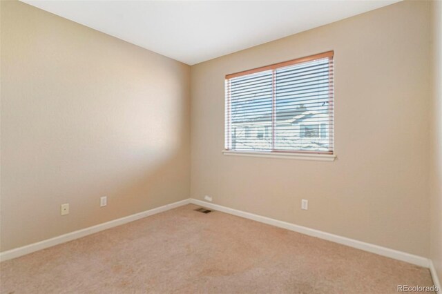 view of carpeted spare room