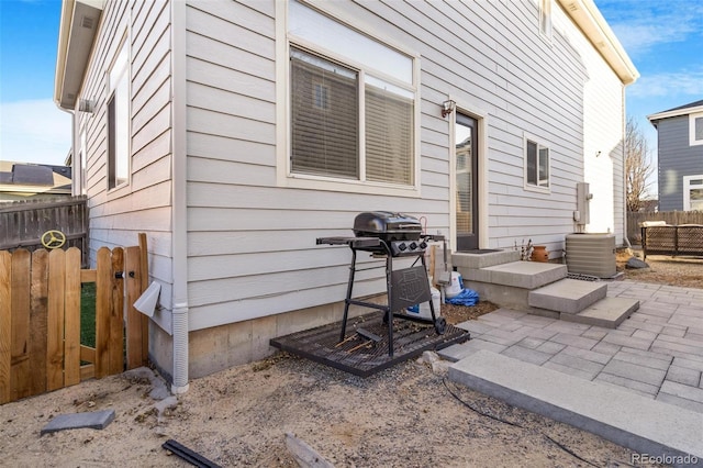 view of side of home with a patio area