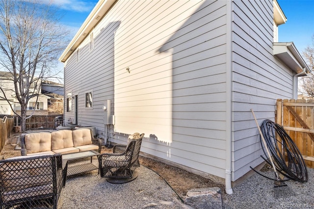 view of side of home with outdoor lounge area