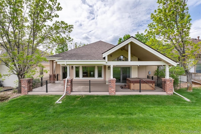 15851 Deer Ridge Dr, Morrison, CO 80465 - rear view of house featuring a hot tub, a patio area, and a shingled roof