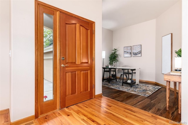 15851 Deer Ridge Dr, Morrison, CO 80465 - foyer entrance with light wood finished floors and baseboards