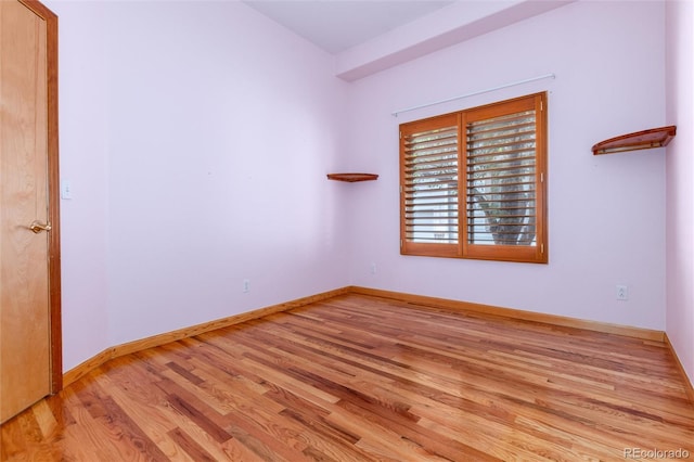 15851 Deer Ridge Dr, Morrison, CO 80465 - spare room with wood finished floors and baseboards