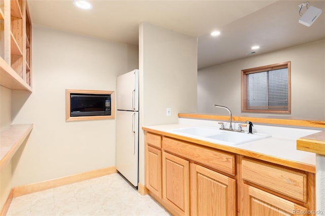 15851 Deer Ridge Dr, Morrison, CO 80465 - kitchen featuring freestanding refrigerator, a sink, recessed lighting, light countertops, and light brown cabinetry