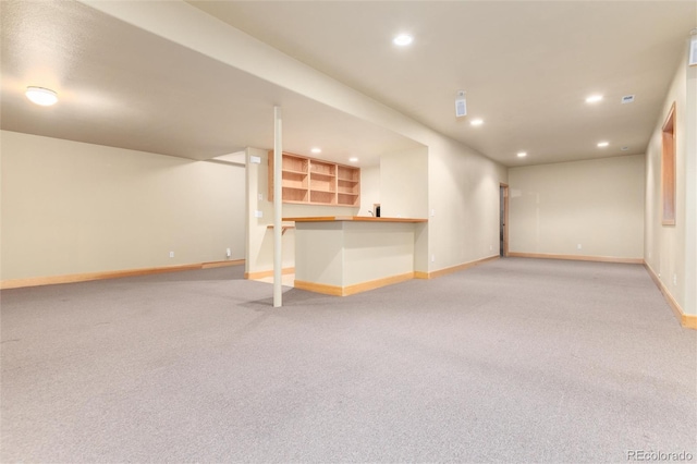 15851 Deer Ridge Dr, Morrison, CO 80465 - finished basement featuring baseboards, recessed lighting, bar, and light carpet