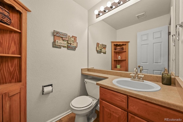 1120 N Calhan Ave, Castle Rock, CO 80104 - bathroom with vanity, toilet, and baseboards