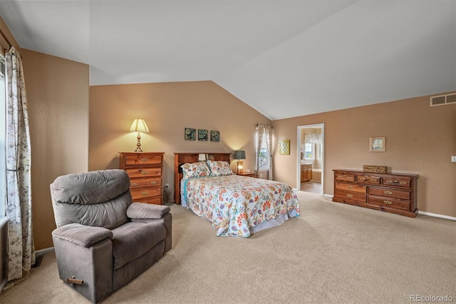 1120 N Calhan Ave, Castle Rock, CO 80104 - carpeted bedroom featuring vaulted ceiling, ensuite bath, and baseboards