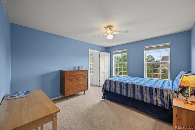 1120 N Calhan Ave, Castle Rock, CO 80104 - carpeted bedroom with a ceiling fan and baseboards