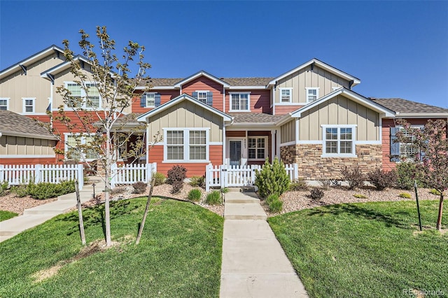 8883 White Prairie Vw, Colorado Springs, CO 80924 - view of front of home featuring board and batten siding, roof with shingles, and stone siding