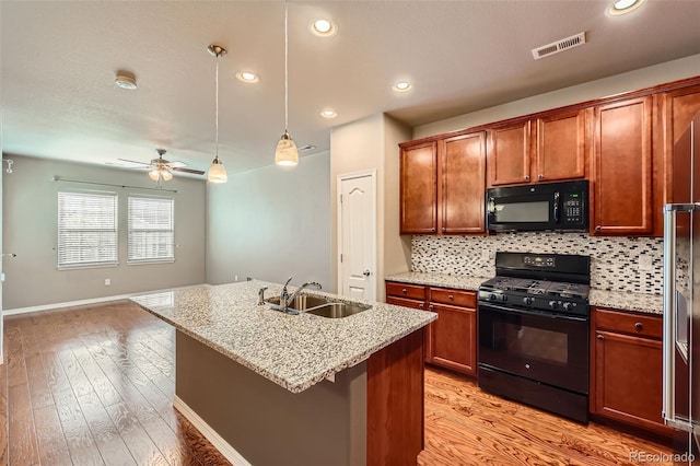 8883 White Prairie Vw, Colorado Springs, CO 80924 - kitchen featuring black appliances, ceiling fan, tasteful backsplash, light wood-style floors, and recessed lighting