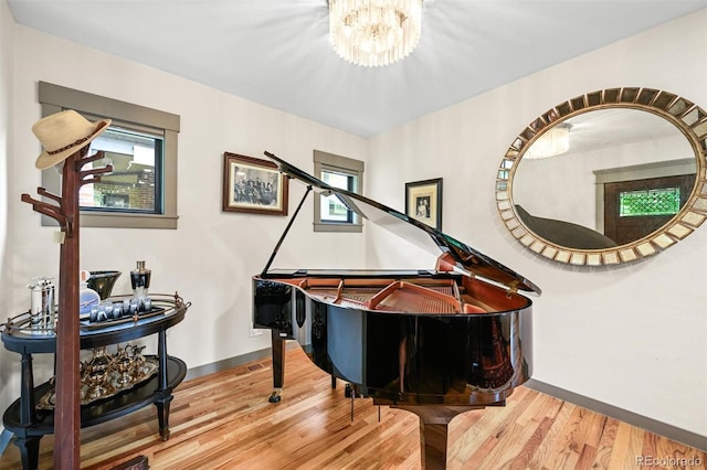 1414 S Vine St, Denver, CO 80210 - living area featuring plenty of natural light, wood finished floors, and a chandelier