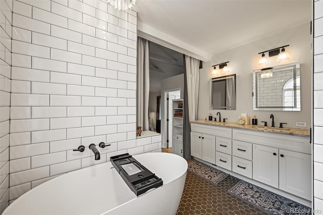1414 S Vine St, Denver, CO 80210 - bathroom with double vanity and a freestanding tub