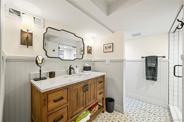 1414 S Vine St, Denver, CO 80210 - full bathroom with vanity, wainscoting, and a shower stall